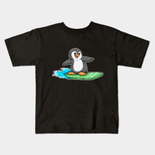 Penguin as Surfer with Surfboard Kids T-Shirt